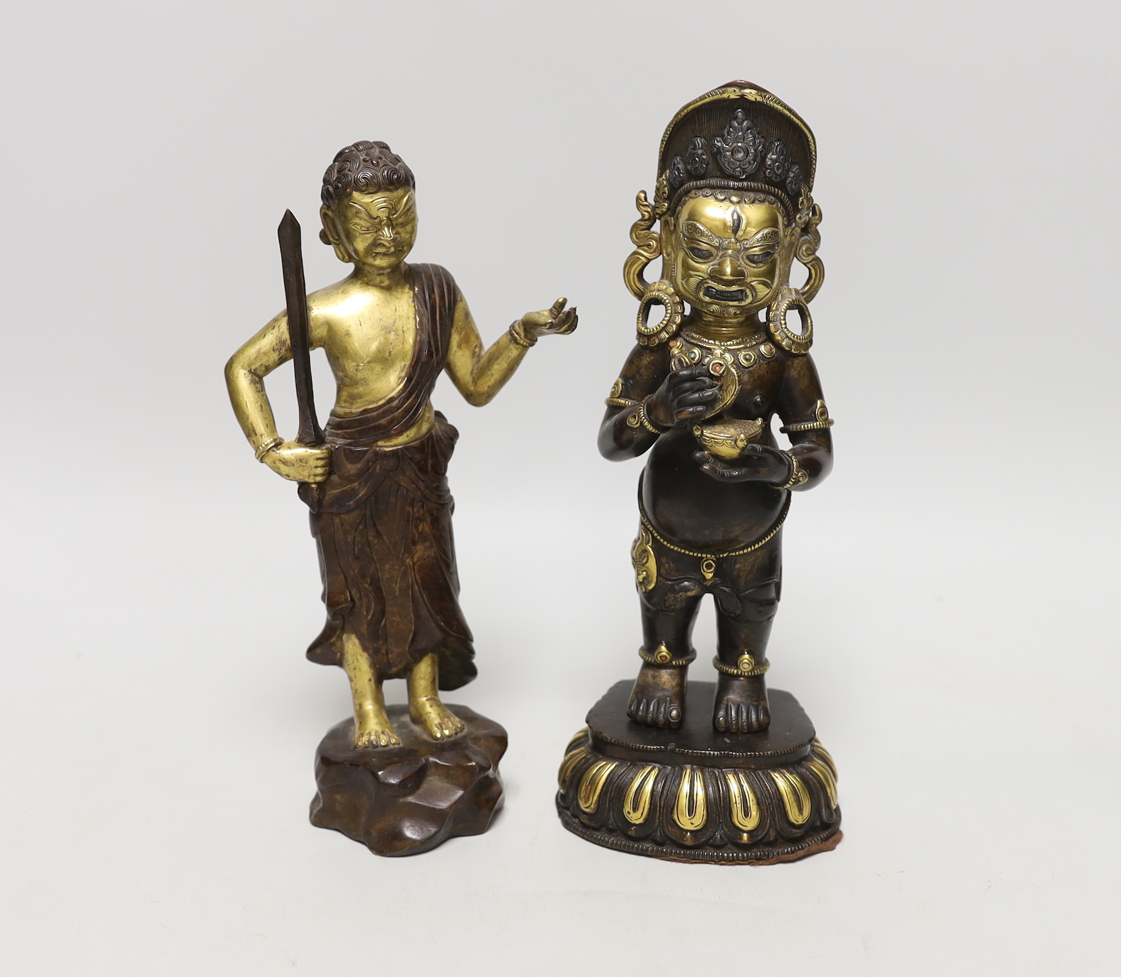 A pair of Sino-Tibetan gilt bronze figures, tallest 24cm